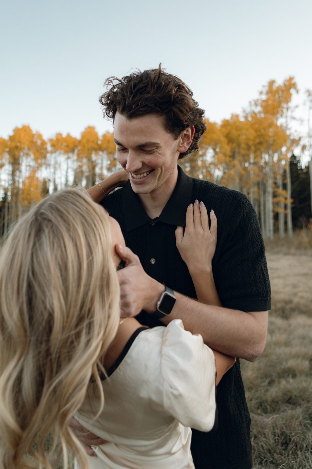 Close couple portrait among fall foliage