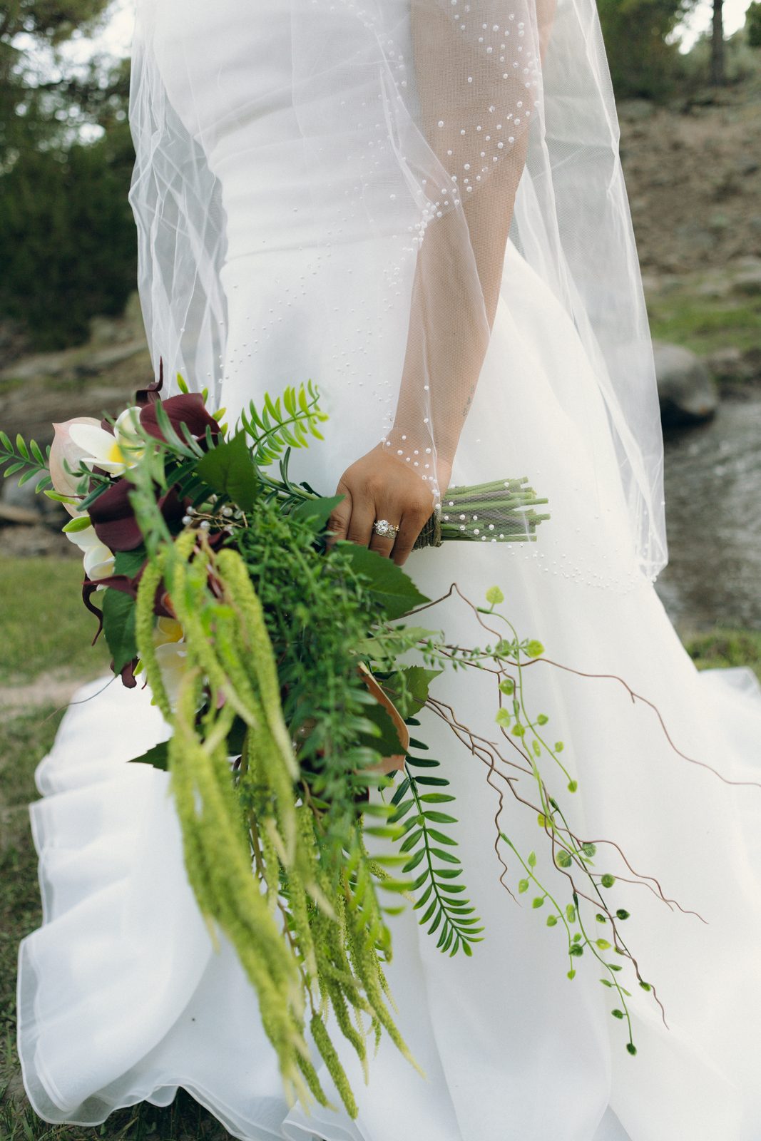Bride's bouquet detail, greenery and blooms